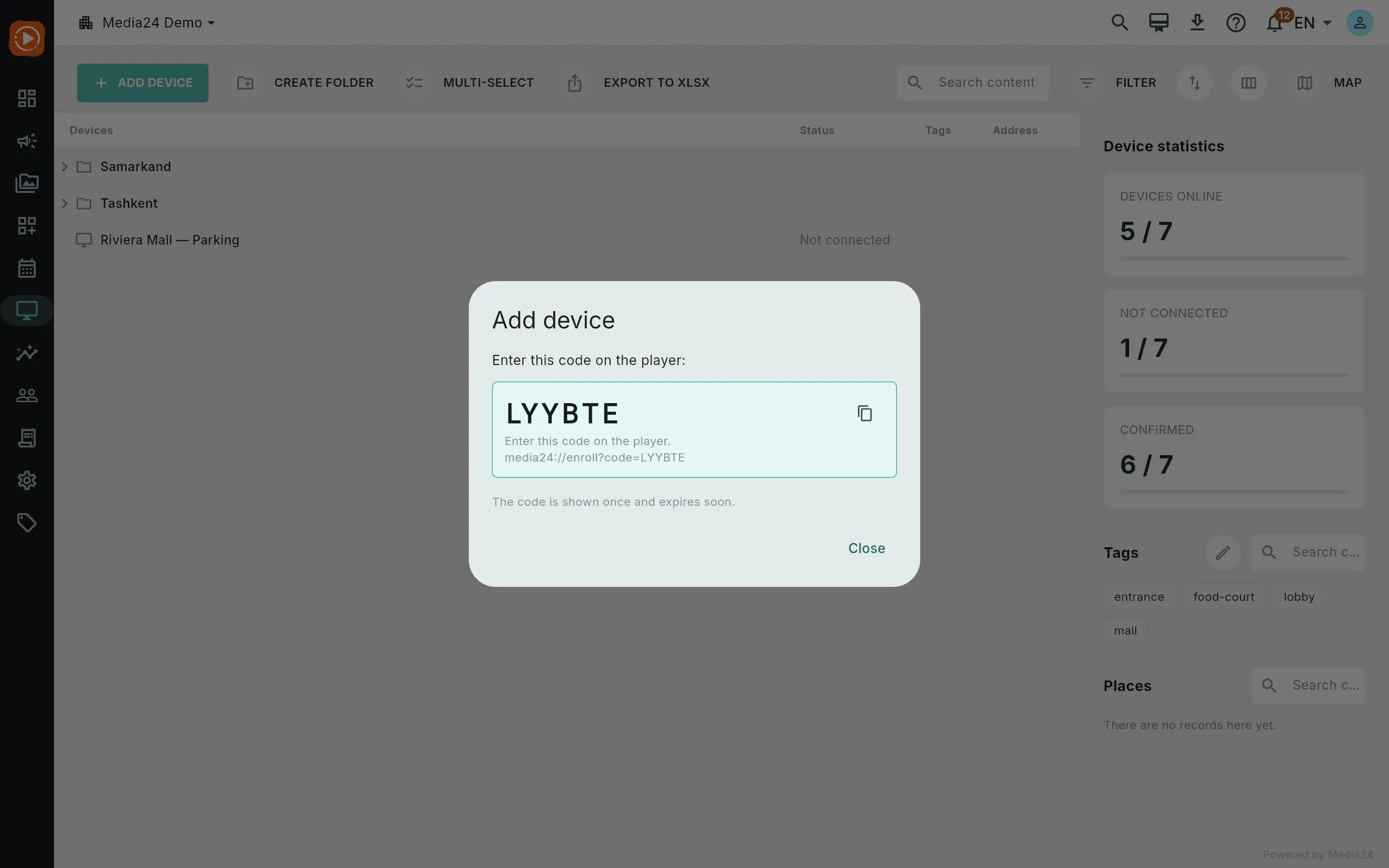 The Add device dialog showing a large one-time activation code with a copy button and enrollment string